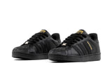 Tenis Concha Negro Oro